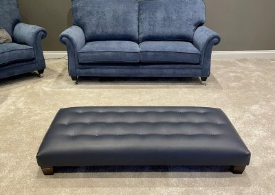 Two seater sofa with button backed foot stool