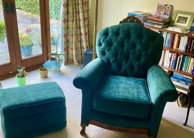 Jade button backed armchair with matching foot stool